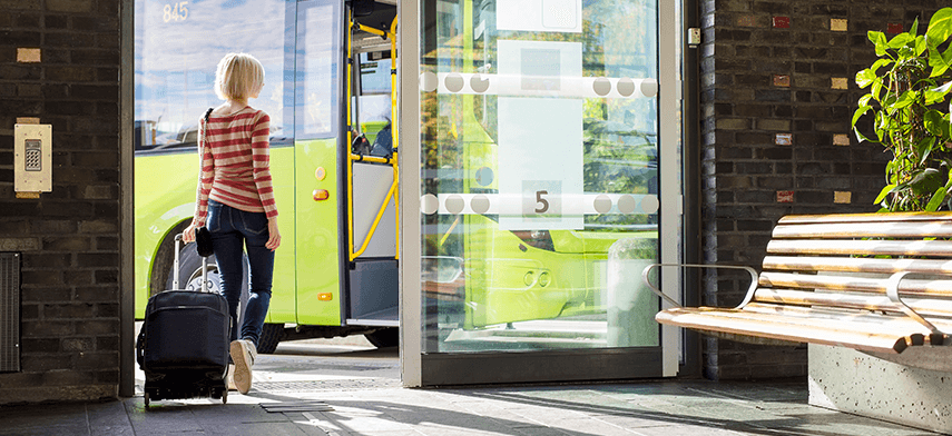 women boarding a bus banner