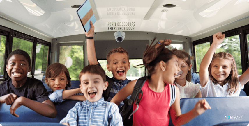Safe school bus ride with happy students Happy and safe students riding the school bus